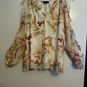 1. State women’s blouse with cold shoulder style. Sheer but not revealing